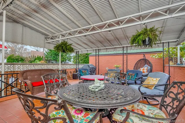 a view of a outdoor sitting area with furniture