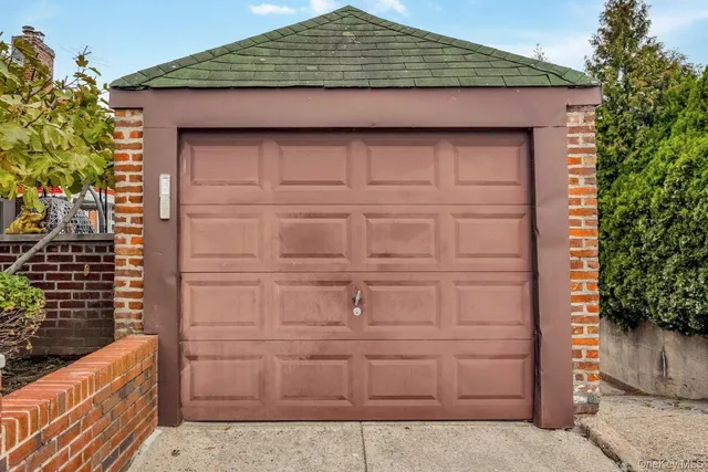 a view of a brick house with a large windows
