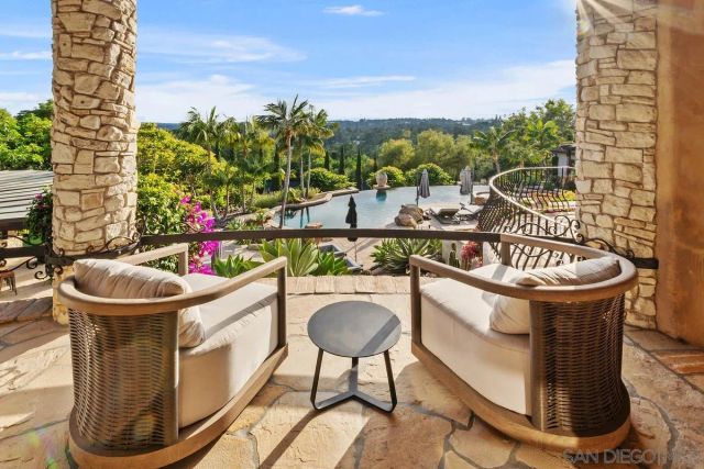 a view of a chairs and table in the patio