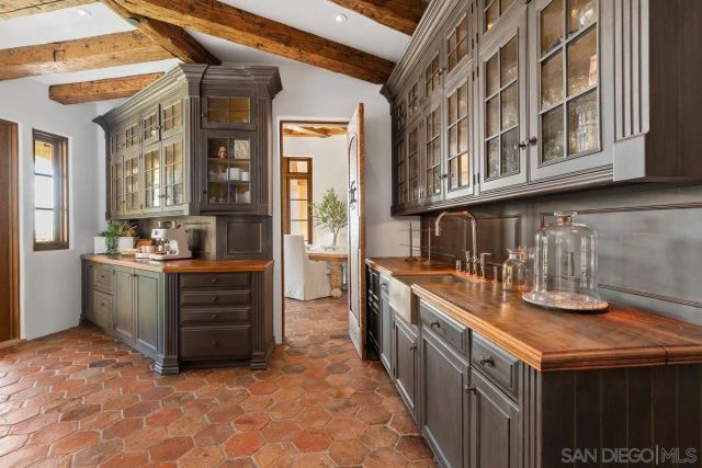 a kitchen with stainless steel appliances granite countertop a sink and cabinets