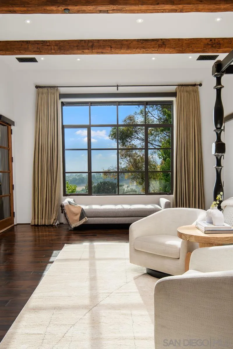 6720 Las Colinas Rancho Santa Fe, CA 92067 - Photo 17 of 36 a bedroom with furniture and large windows