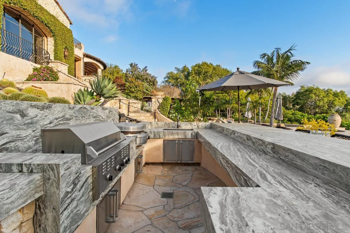 6720 Las Colinas Rancho Santa Fe, CA 92067 - Photo 22 of 36 a swimming pool with outdoor seating and yard