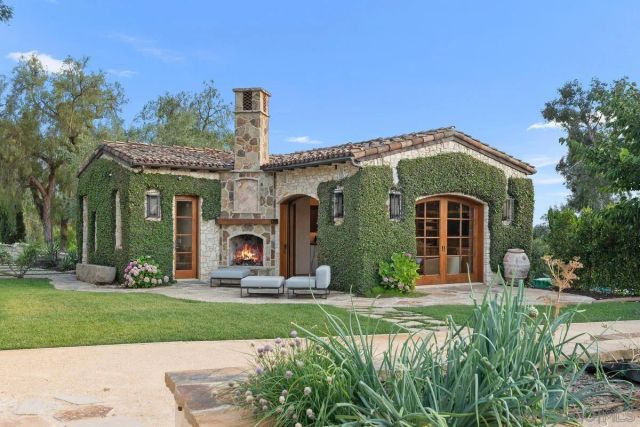 a kitchen with a stove a sink a counter top space and appliances