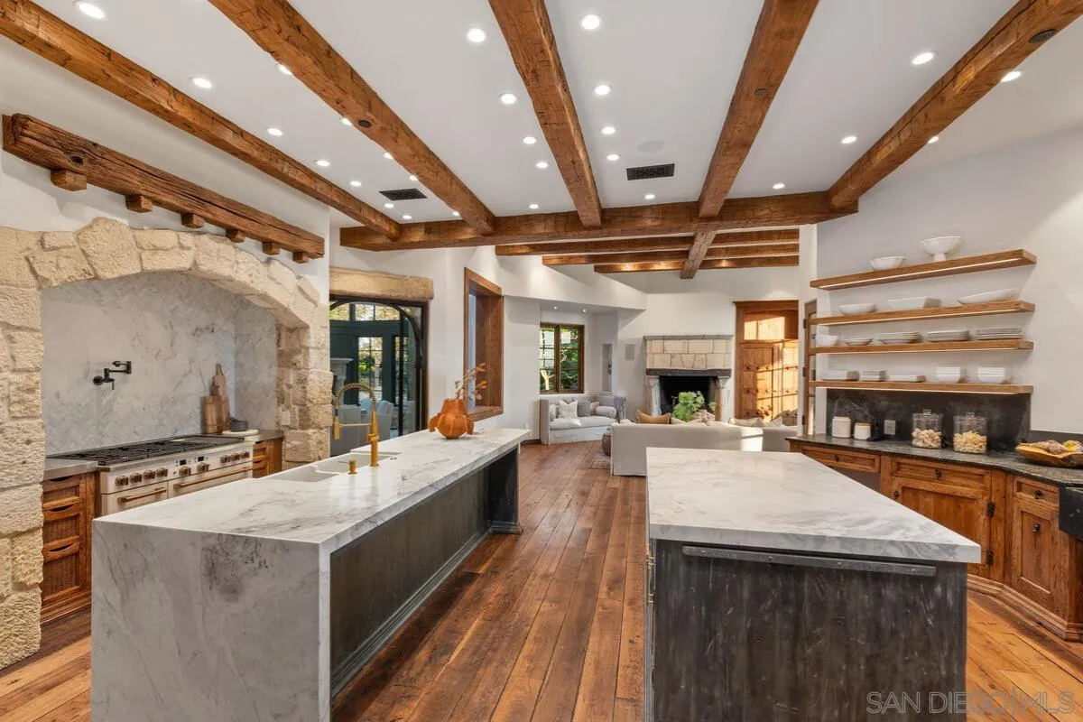 6720 Las Colinas Rancho Santa Fe, CA 92067 - Photo 6 of 36 a large white kitchen with a large window