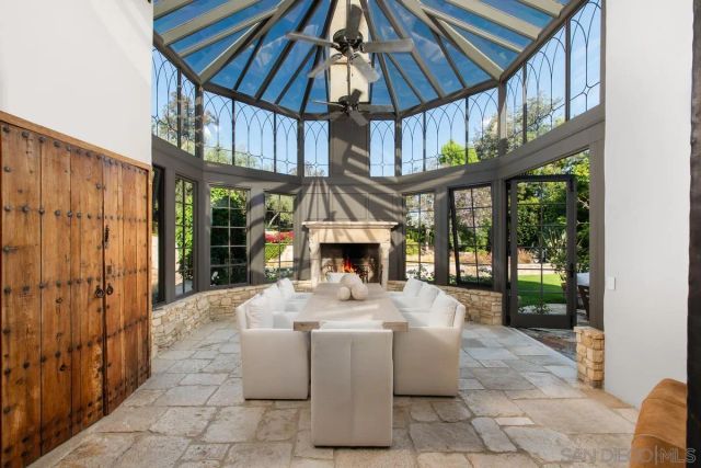 a view of a patio with a table and chairs