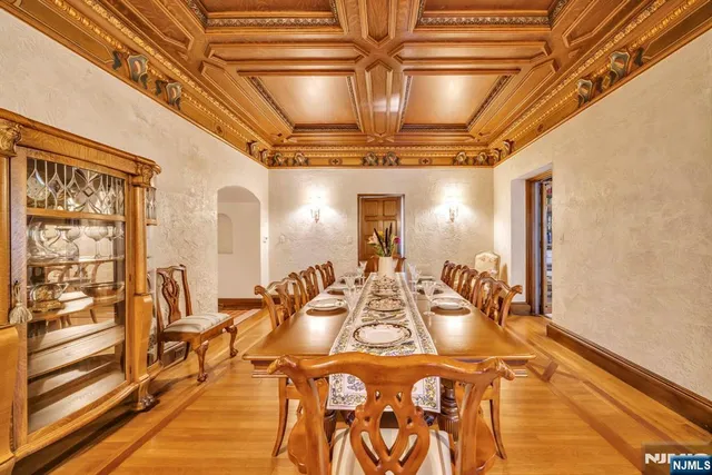 a view of a dining room with a table and chairs