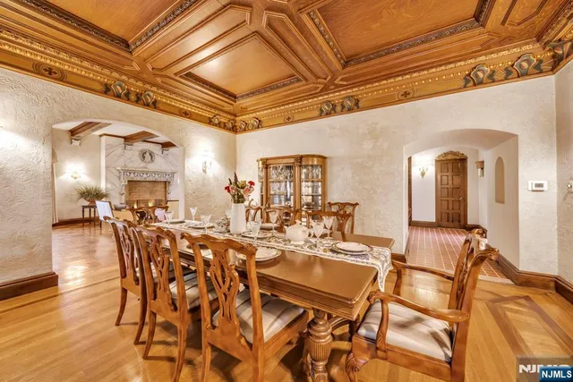 a kitchen with a sink a potted plant and a stove