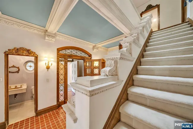 a living room with furniture and a dining table with wooden floor