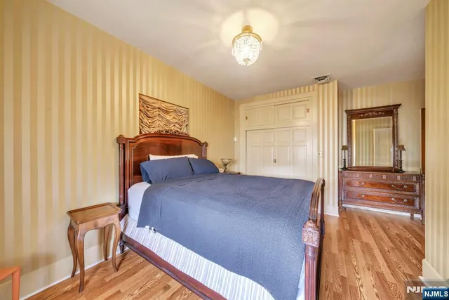 a view of hotel and hall with wooden floor