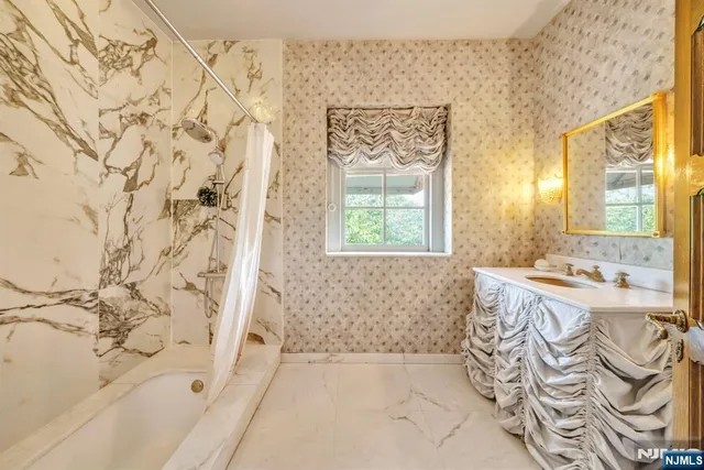 a bedroom with a bed and a mirror