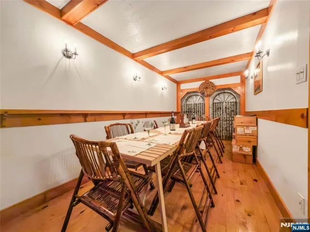 a view of a patio with chairs and potted plants