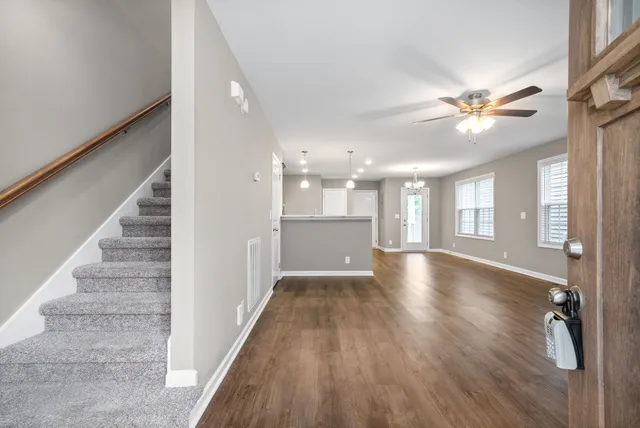 a view of an entryway with wooden floor