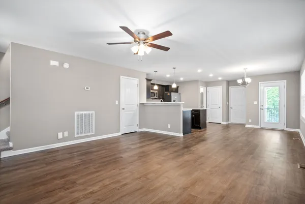 a view of a kitchen with a sink and a window