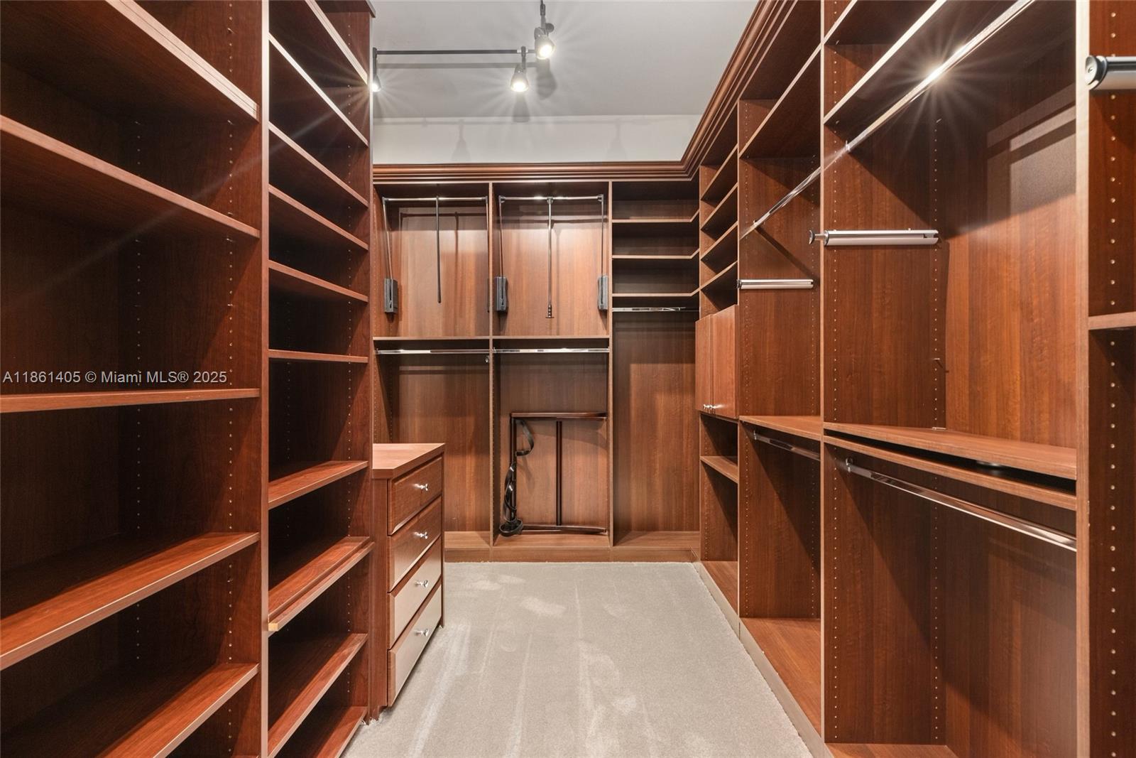 1504 Island Boulevard Aventura, FL 33160 - Photo 31 of 39 a view of walk in closet with empty racks