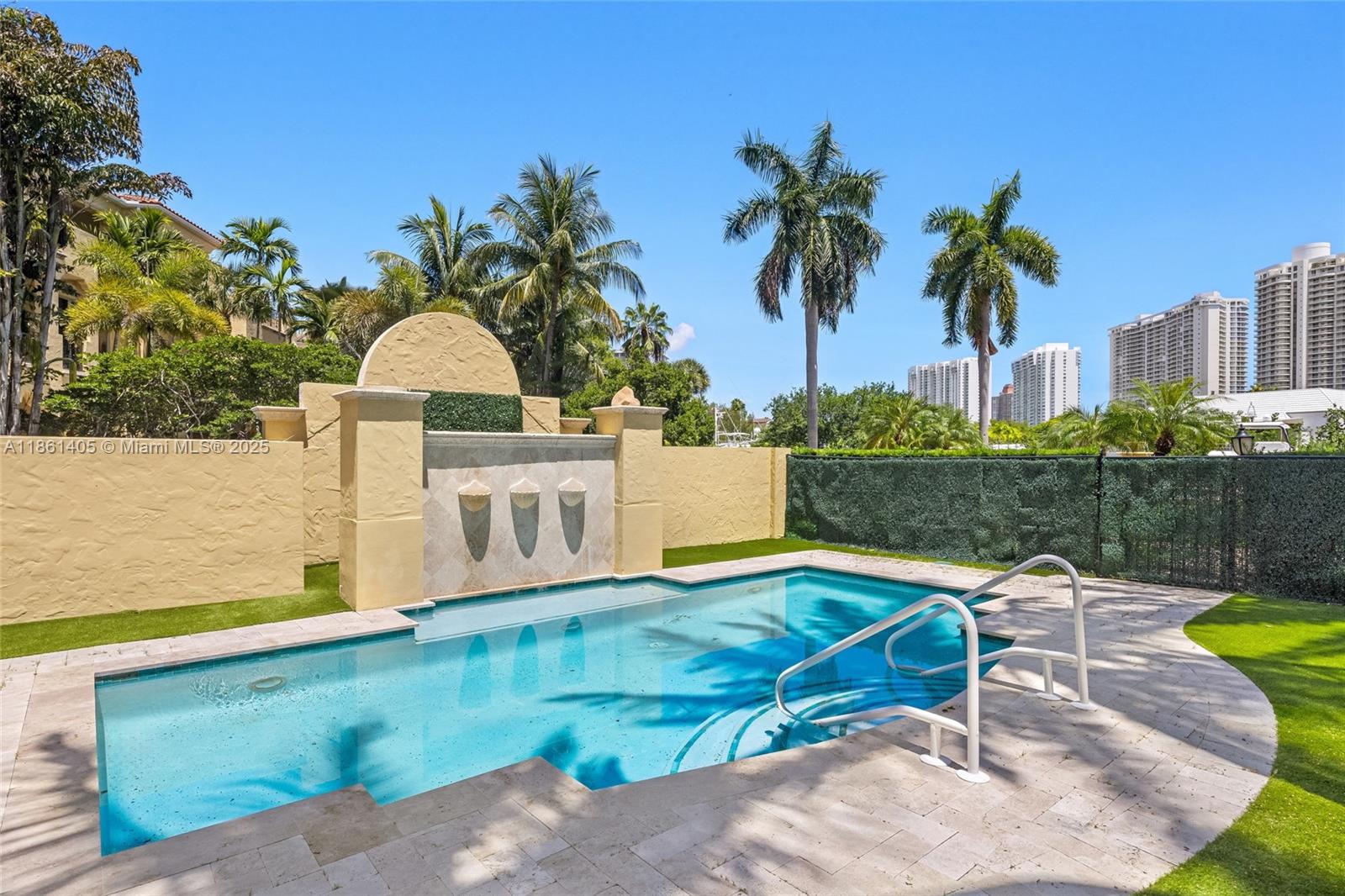 1504 Island Boulevard Aventura, FL 33160 - Photo 35 of 39 a view of a swimming pool with a lounge chairs