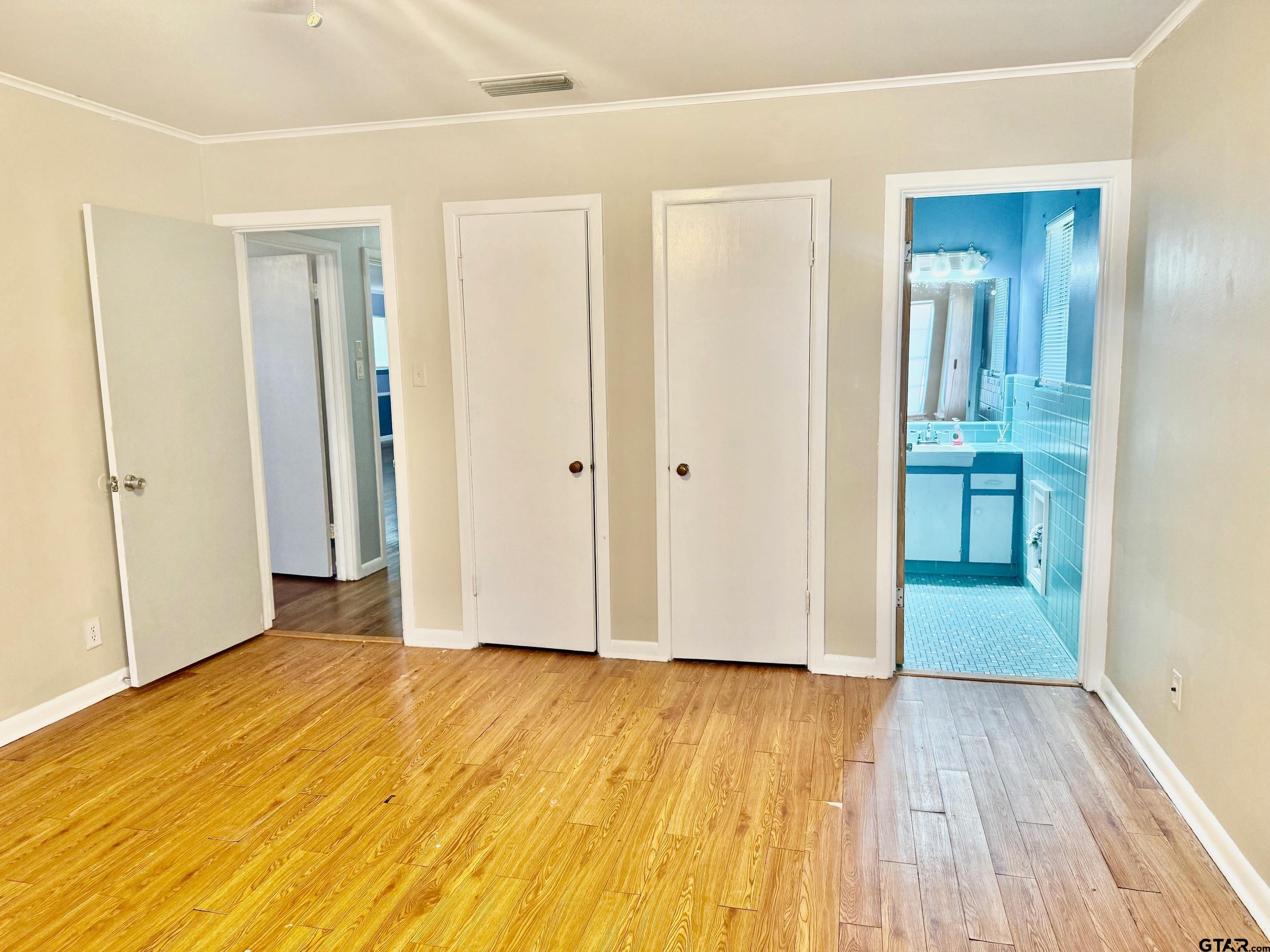 2408 Hunter Street Tyler, TX 75701 - Photo 14 of 33 an empty room with wooden floor and closet