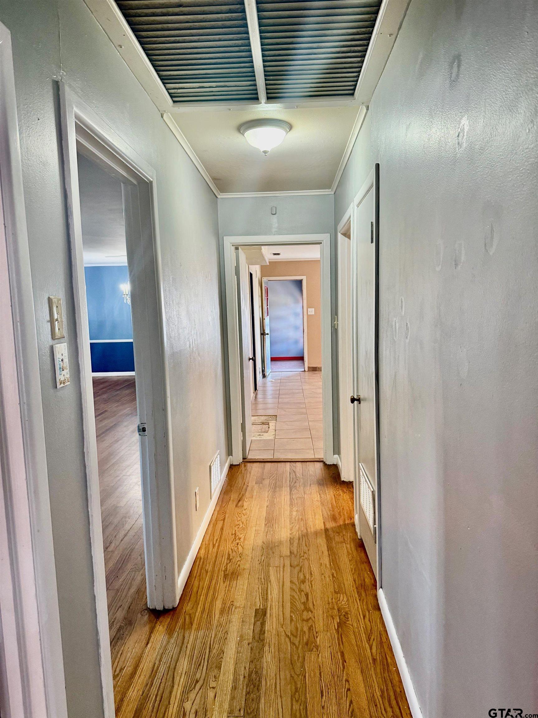 2408 Hunter Street Tyler, TX 75701 - Photo 17 of 33 a view of a hallway with wooden floor