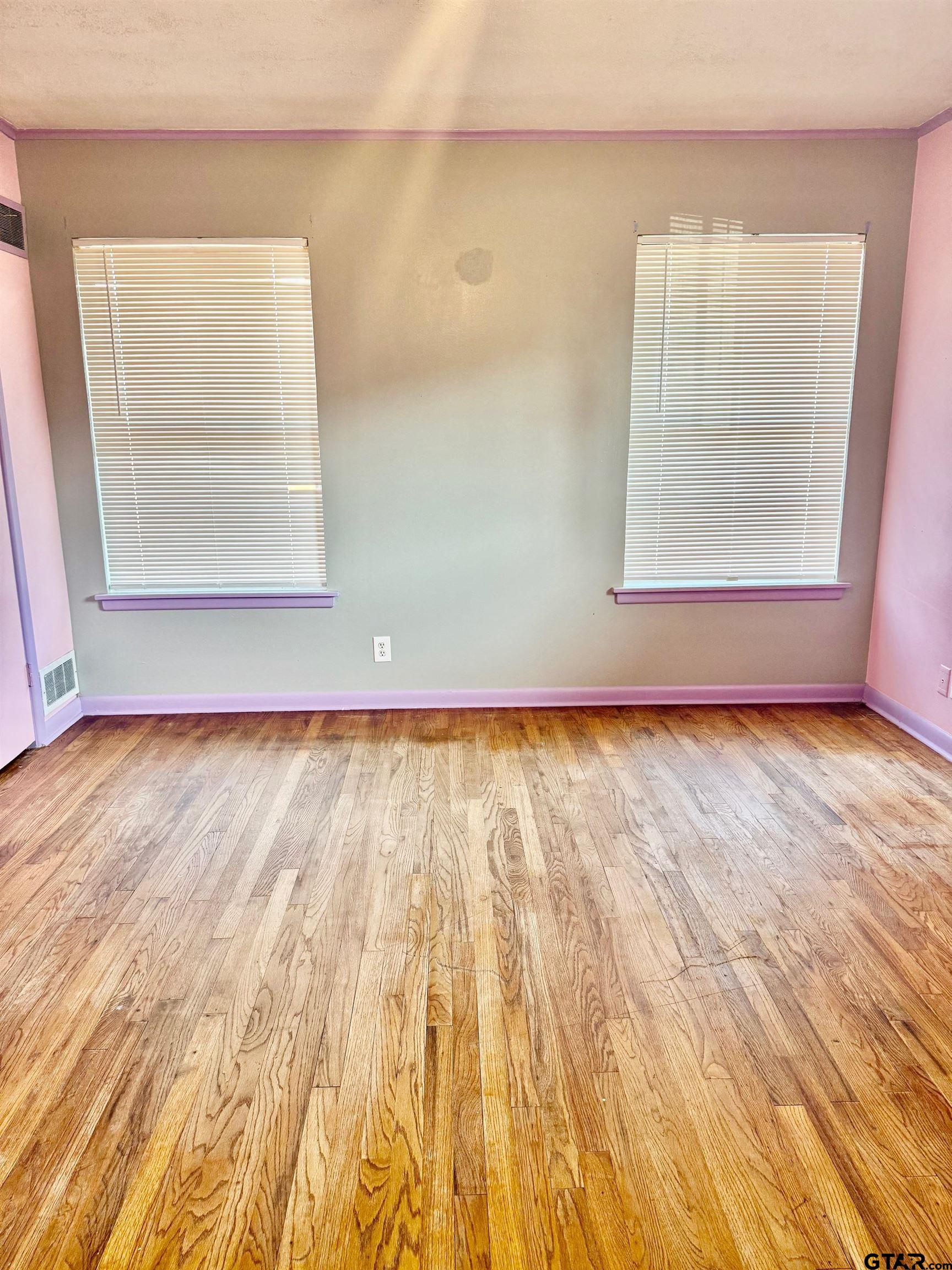 2408 Hunter Street Tyler, TX 75701 - Photo 19 of 33 a view of room with window and wooden floor