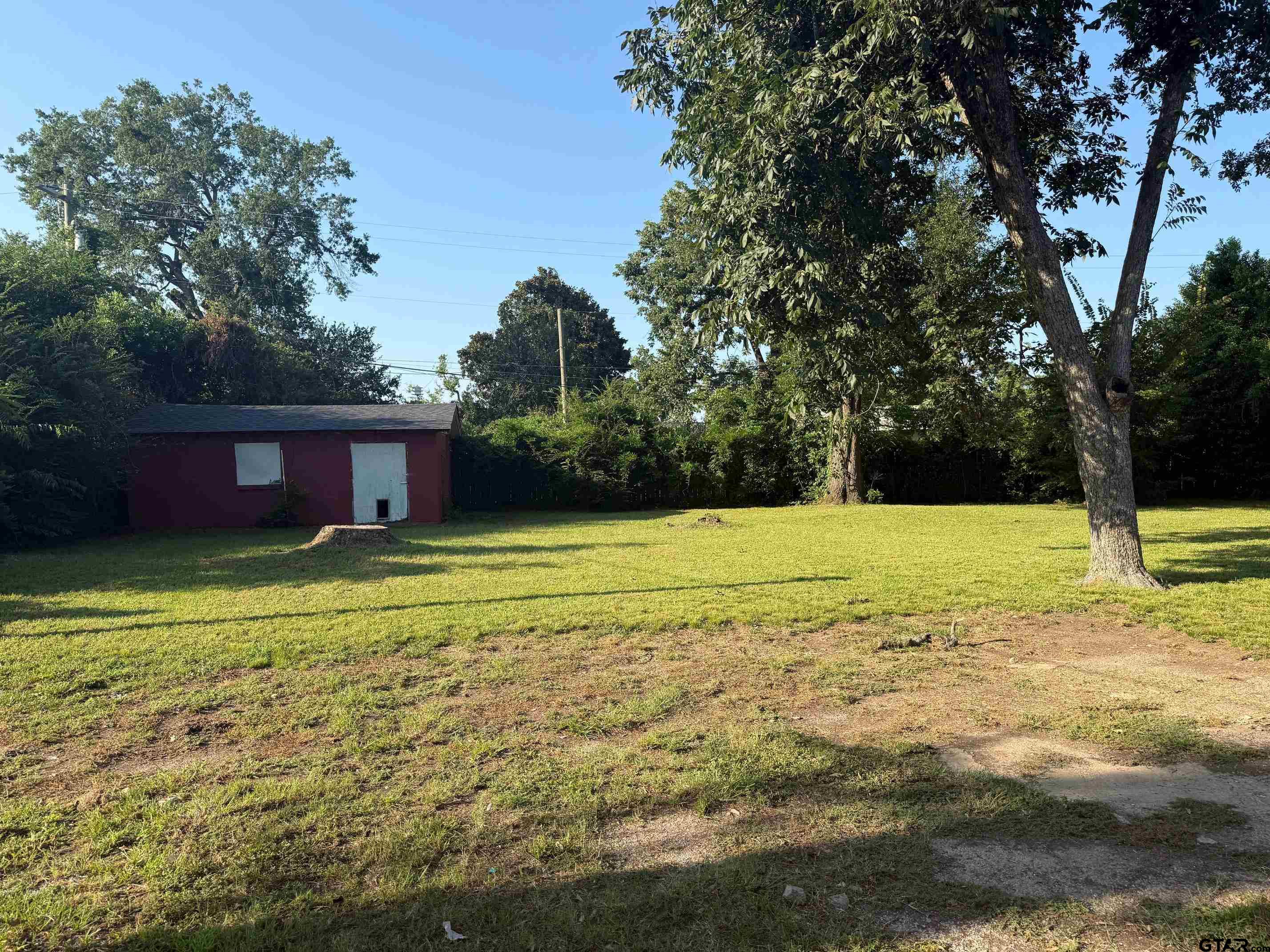 2408 Hunter Street Tyler, TX 75701 - Photo 29 of 33 a view of a house with a yard