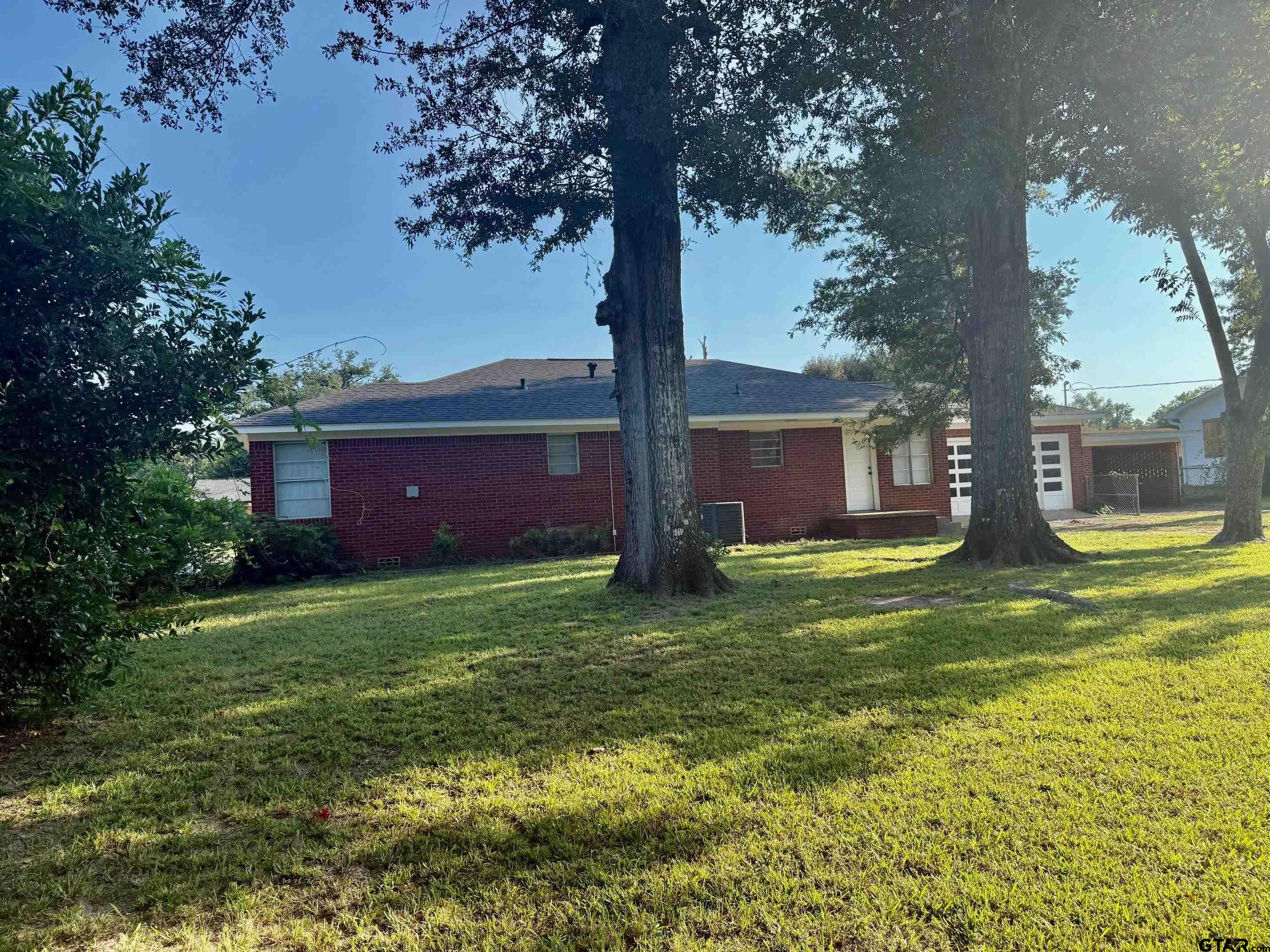 2408 Hunter Street Tyler, TX 75701 - Photo 33 of 33 a house view with a garden space