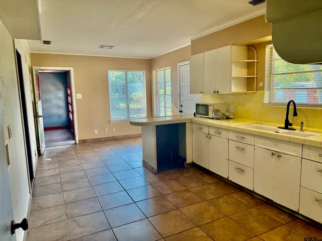 a view of a kitchen with a sink