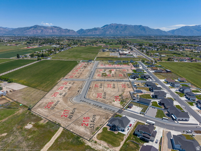 3150 South 5250 West, Unit 210 Hooper, UT 84315 - Photo 3 of 11 Aerial perspective showcasing a developing residential subdivision with clearly delineated parcels