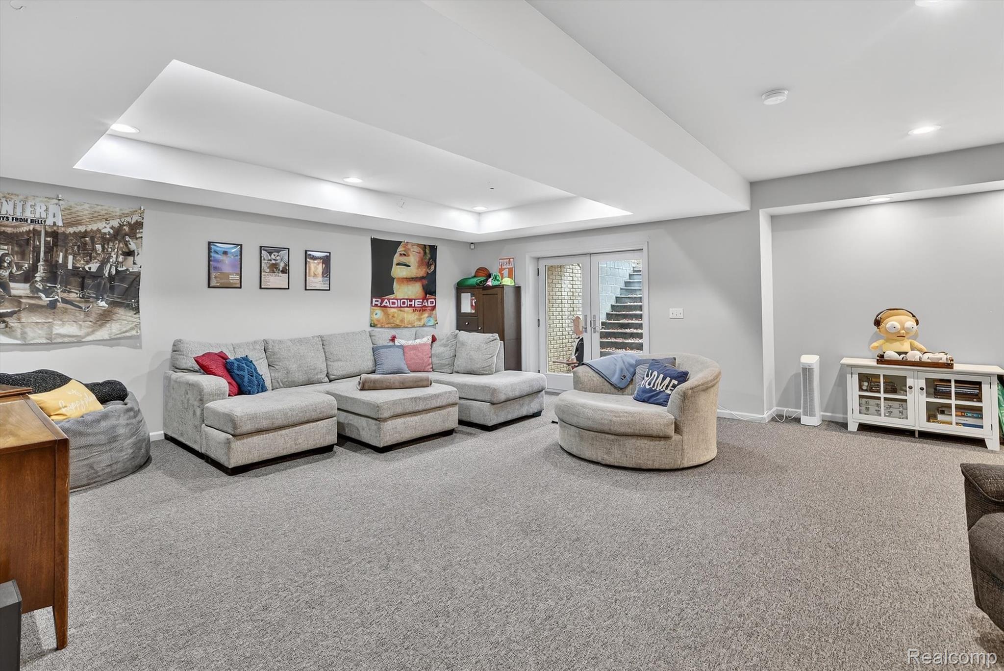552 North McKinley Road Flushing, MI 48433 - Photo 52 of 98 Living room with carpet flooring, a tray ceiling, and recessed lighting