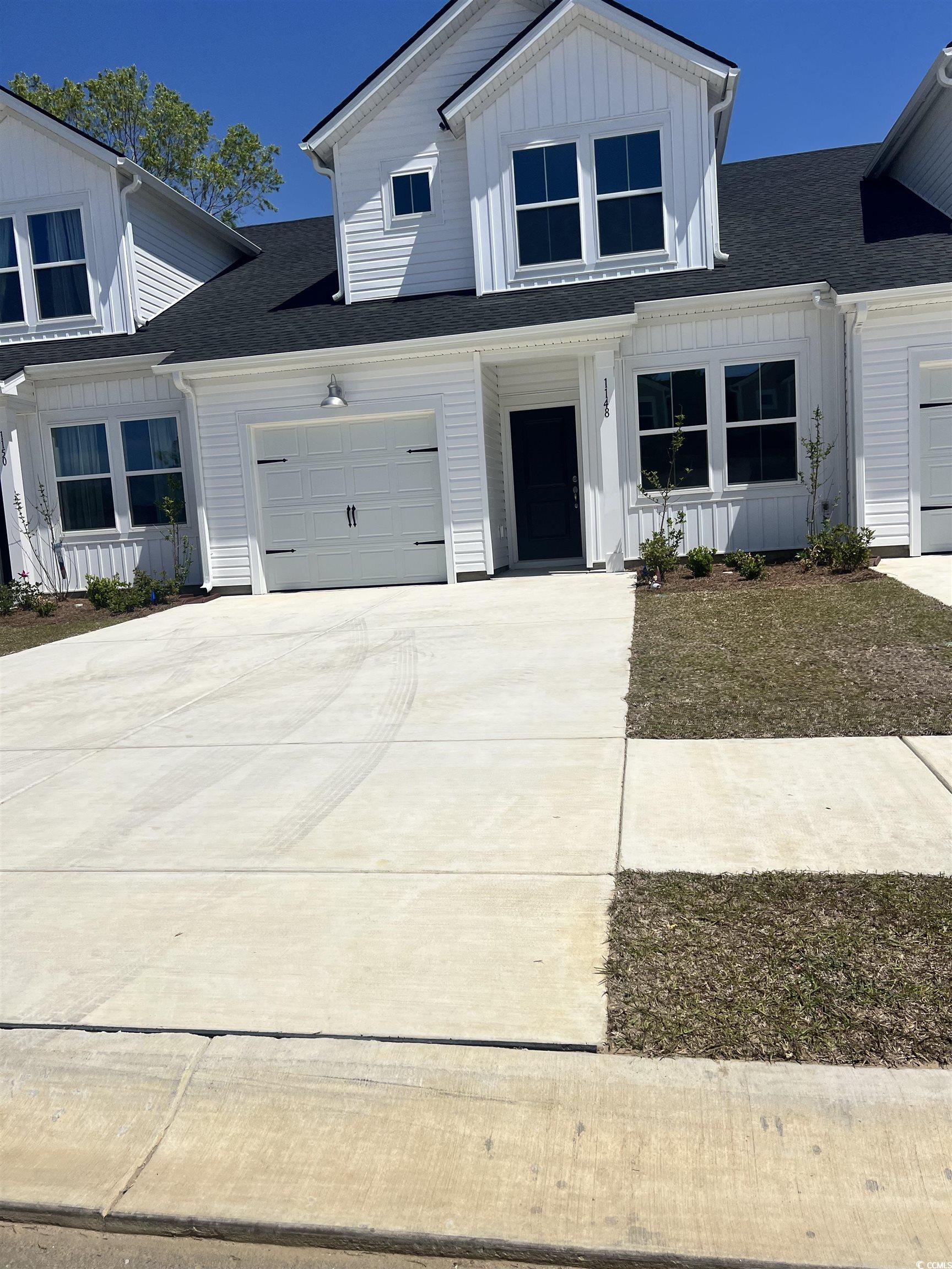 1148 Blueback Herring Way, Unit 146 Conway, SC 29526 - Photo 1 of 22 Modern farmhouse style home featuring board and ba