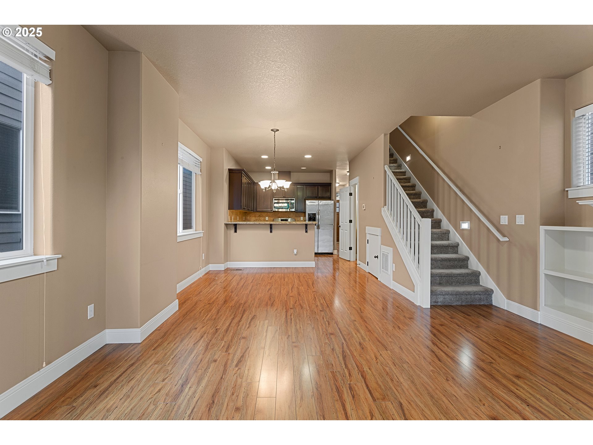 9622 Southwest Everett Terrace Tigard, OR 97223 - Photo 15 of 43 a view of a room with wooden floors and stairs