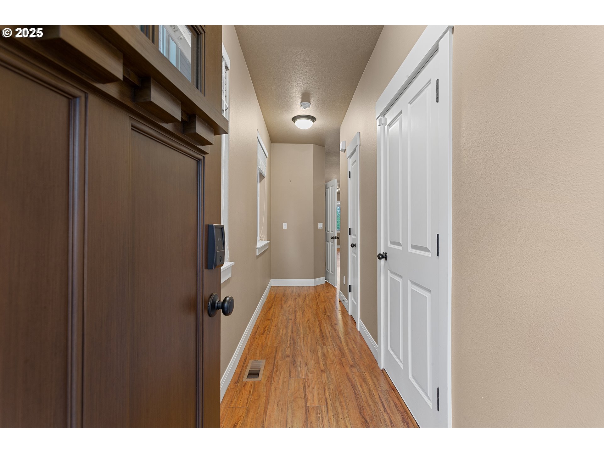 9622 Southwest Everett Terrace Tigard, OR 97223 - Photo 5 of 43 a view of hallway with wooden floor