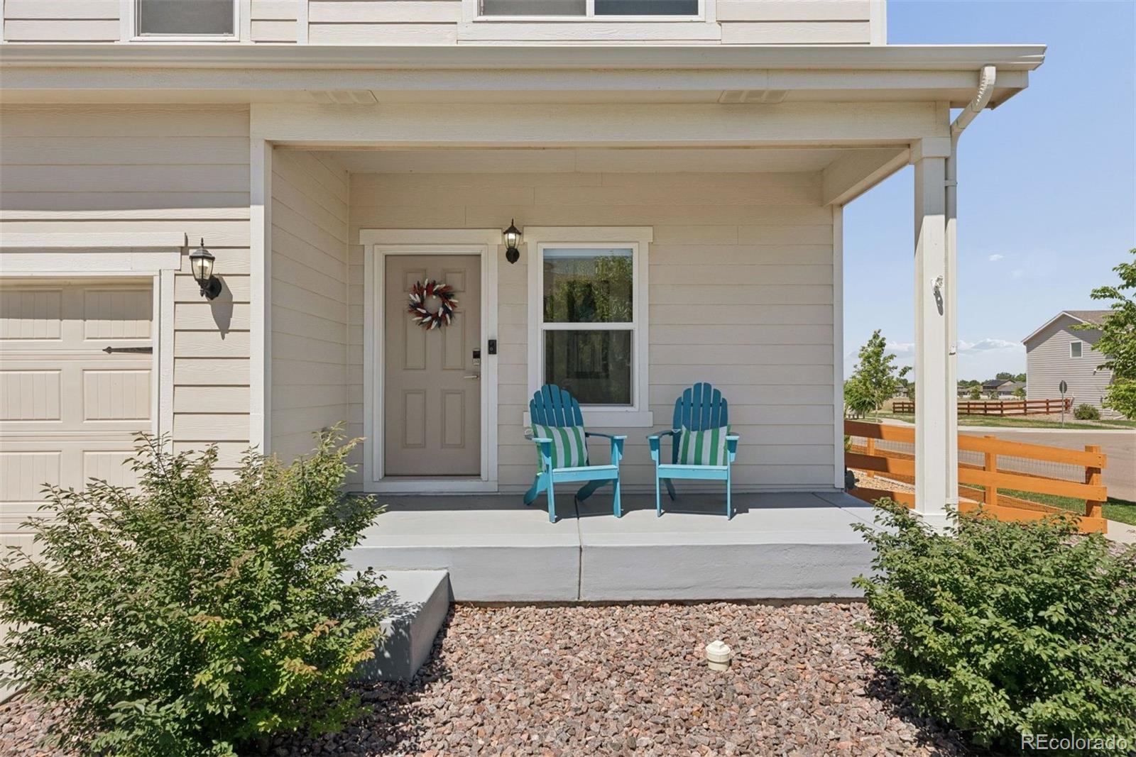 7307 Animas Avenue Frederick, CO 80530 - Photo 9 of 49 a front view of a house with garden