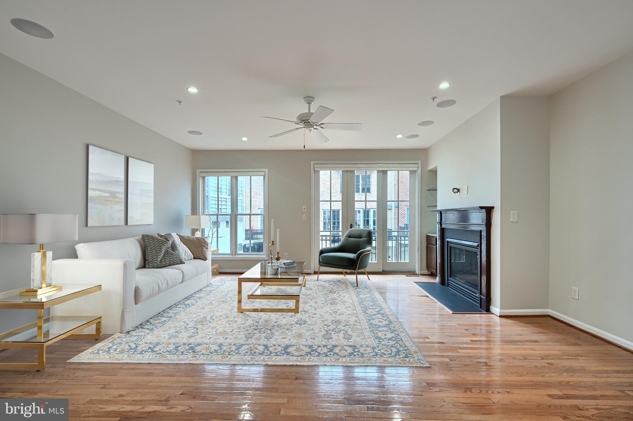 1205 Dockside Circle Baltimore, MD 21224 - Photo 11 of 39 a living room with fireplace furniture and a wooden floor