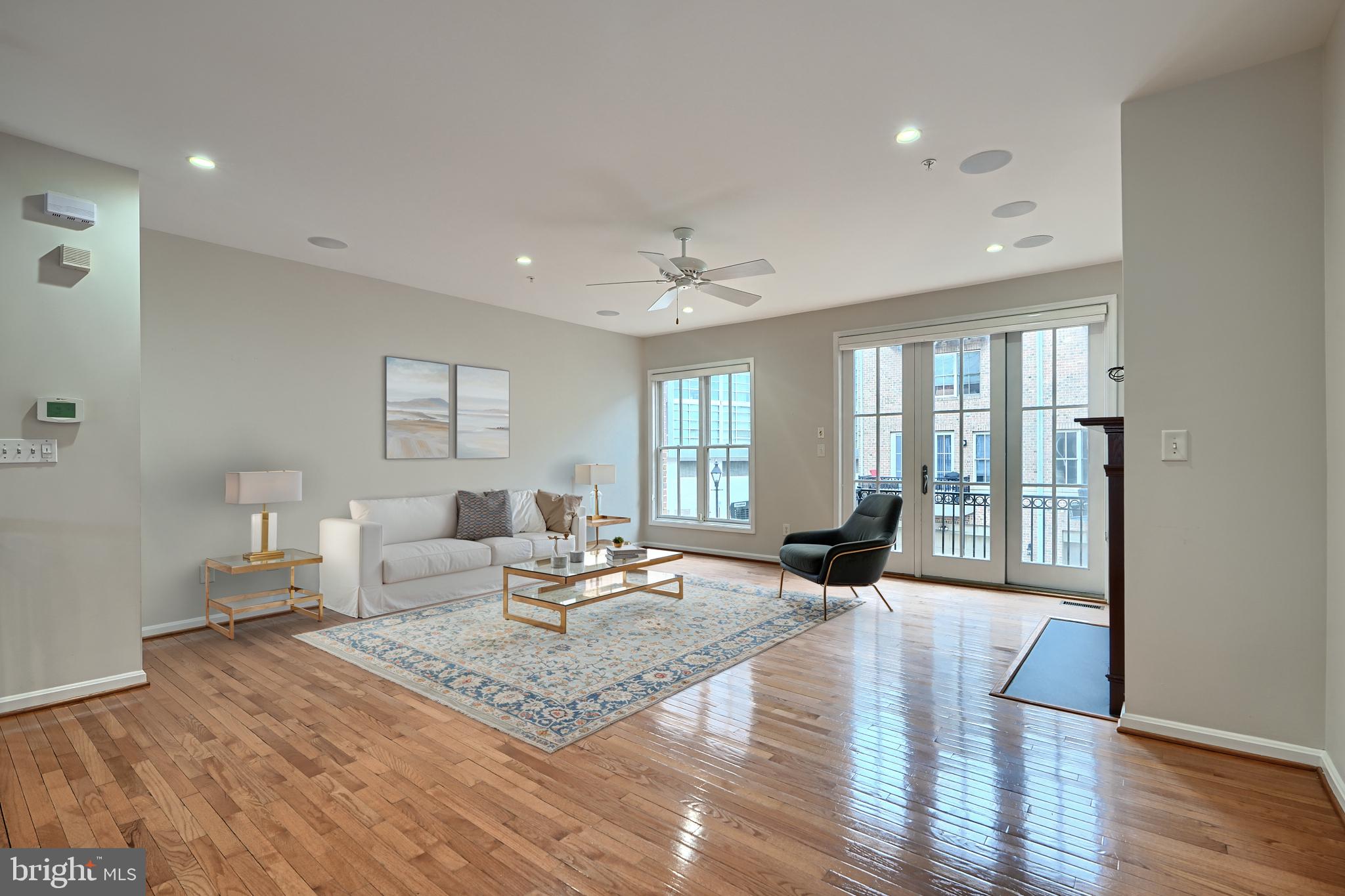 1205 Dockside Circle Baltimore, MD 21224 - Photo 12 of 39 a living room with furniture large window and wooden floor