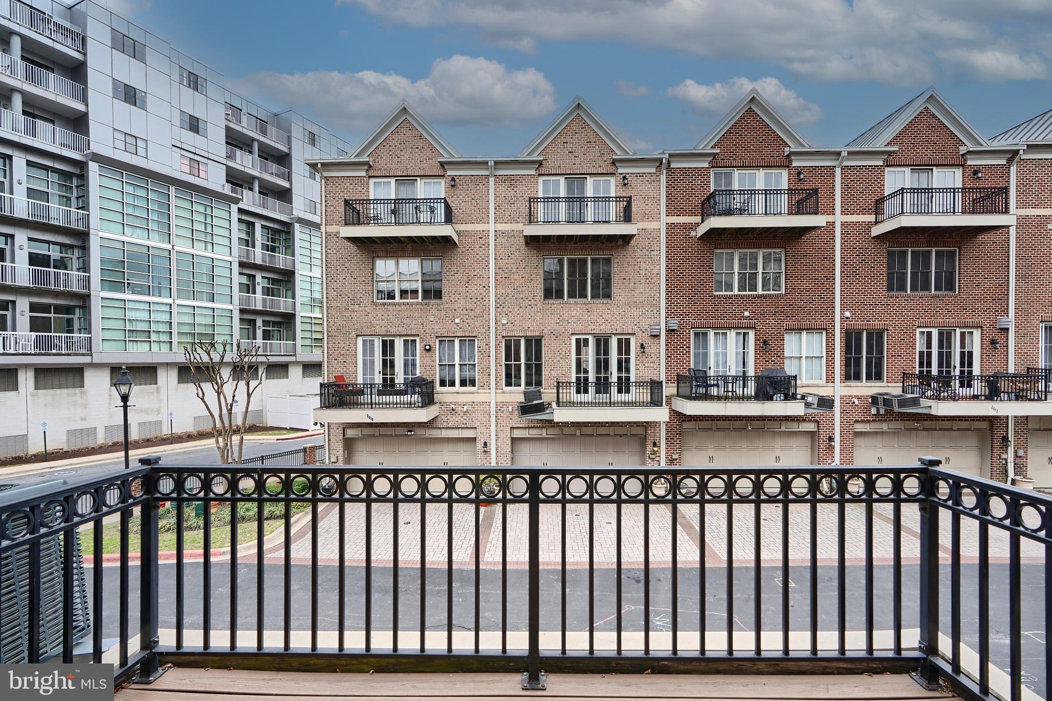 1205 Dockside Circle Baltimore, MD 21224 - Photo 13 of 39 a view of a brick building next to a yard