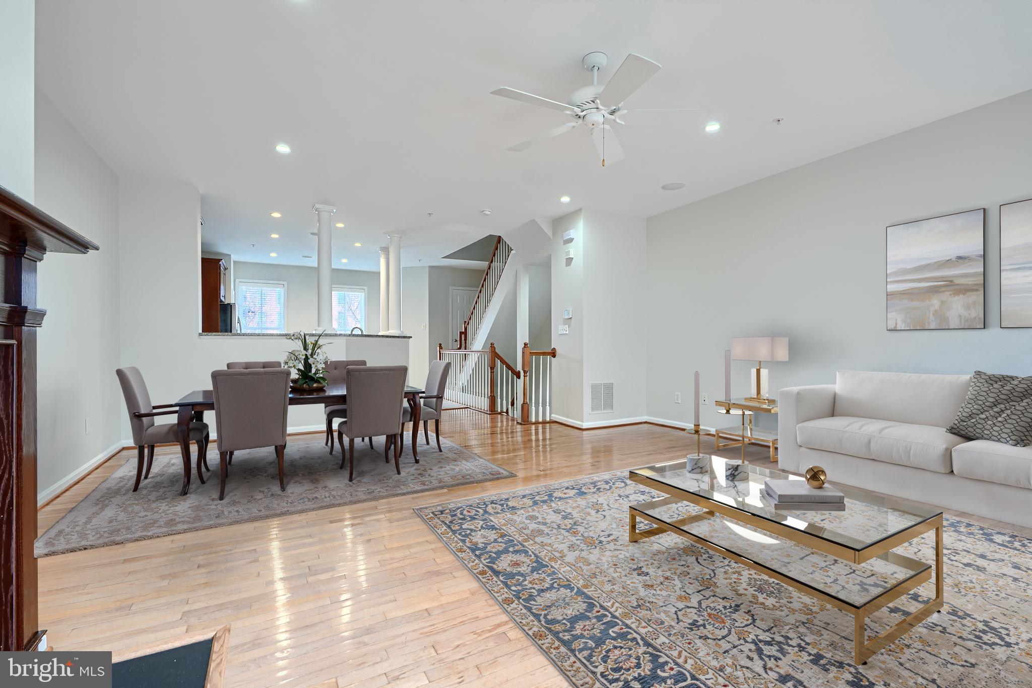 1205 Dockside Circle Baltimore, MD 21224 - Photo 15 of 39 a living room with furniture a wooden floor and next to a dining table