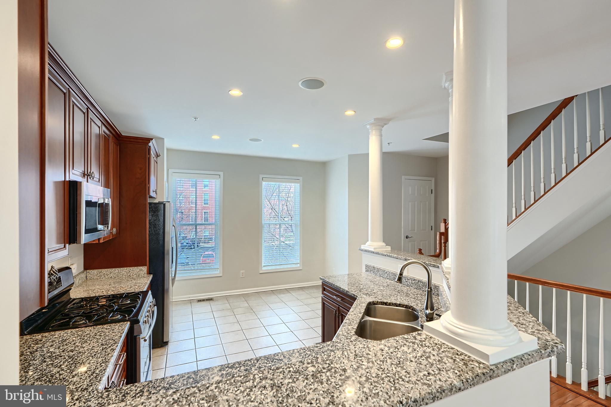 1205 Dockside Circle Baltimore, MD 21224 - Photo 16 of 39 a living room with a rug floor and a rug