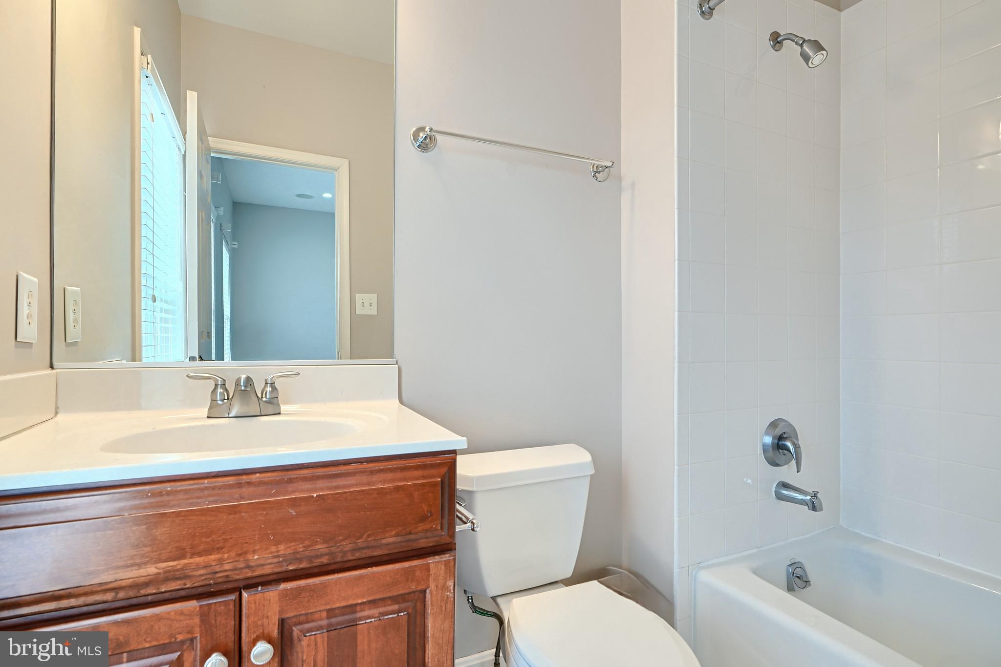 1205 Dockside Circle Baltimore, MD 21224 - Photo 36 of 39 a bathroom with a sink a toilet and a bathtub