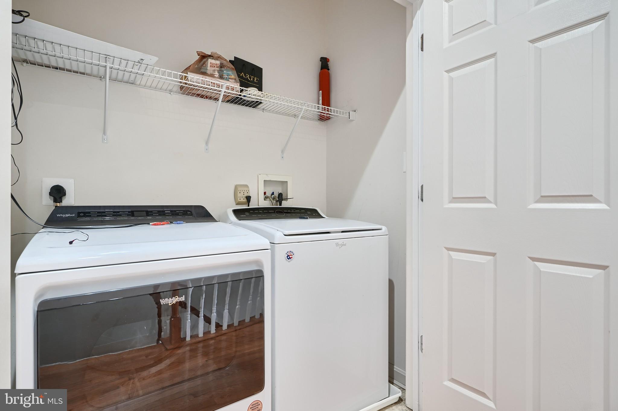 1205 Dockside Circle Baltimore, MD 21224 - Photo 37 of 39 a utility room with dryer and washer