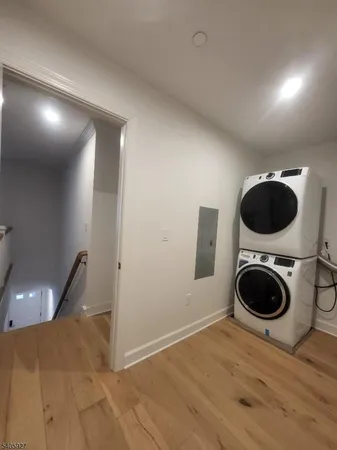 a view of a hallway with washer and dryer