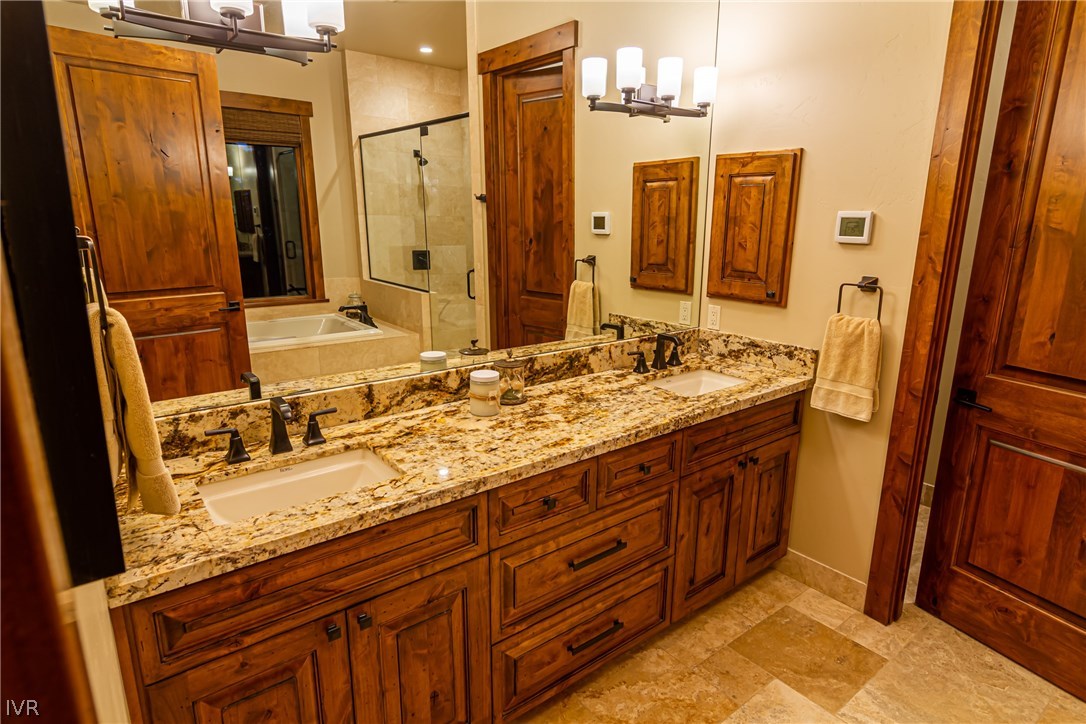 627 Crystal Peak Road Incline Village, NV 89451 - Photo 2 of 4 a bathroom with a granite countertop sink and a mirror