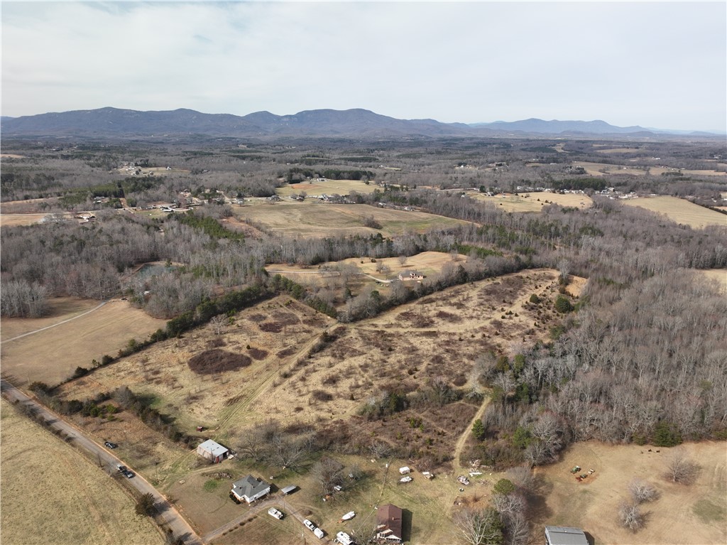4525 Babb Road Greer, SC 29651 - Photo 11 of 30 This expansive rural property offers sweeping mountain views and ample space for development.