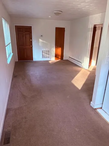 a view of empty room with front door