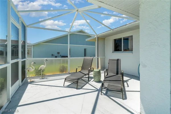 a patio with table and chairs