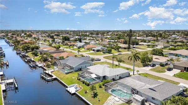 an aerial view of a house with a ocean view