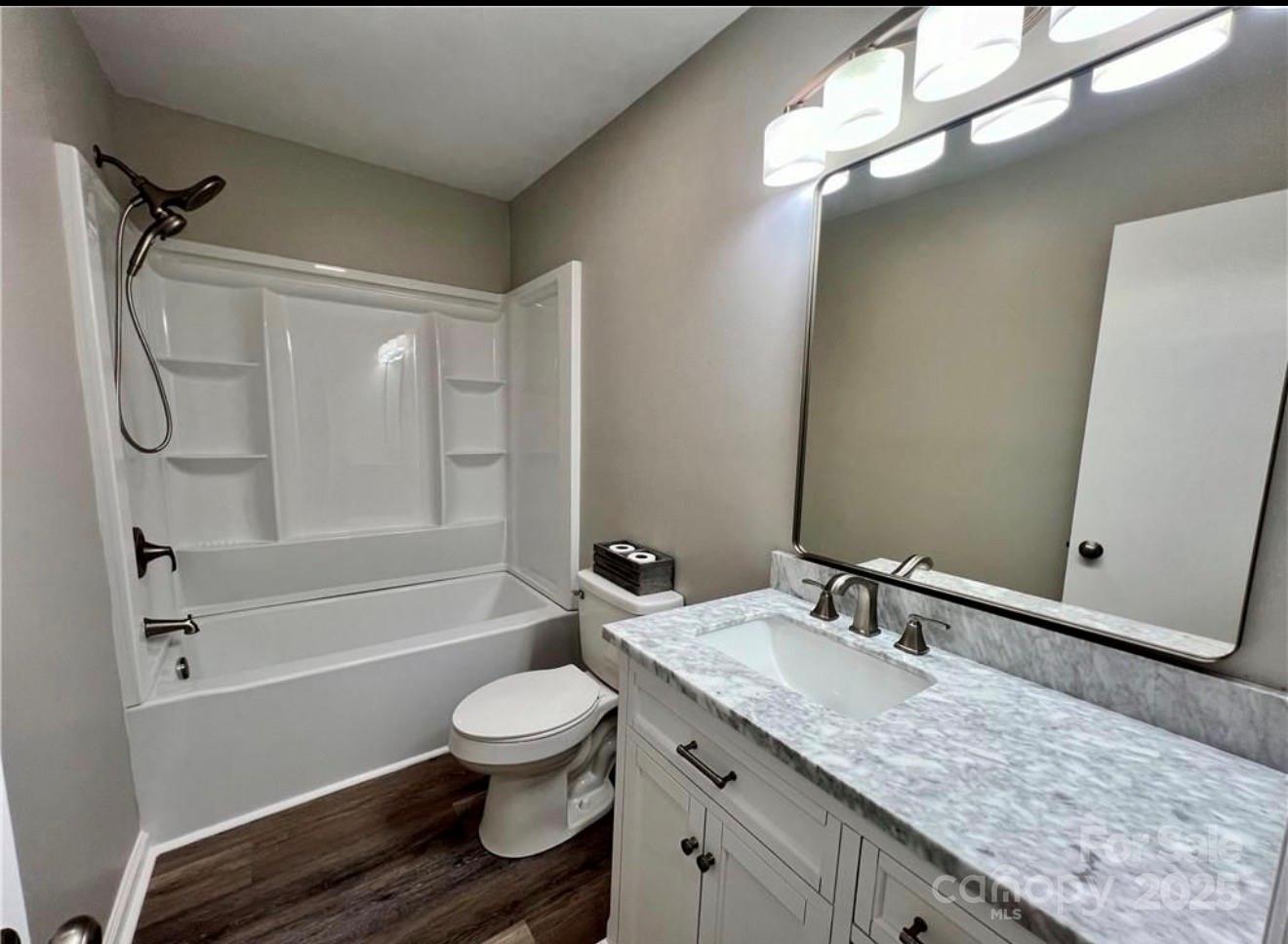 276 Country Club Road Wilkesboro, NC 28697 - Photo 11 of 16 a bathroom with a granite countertop sink toilet and shower
