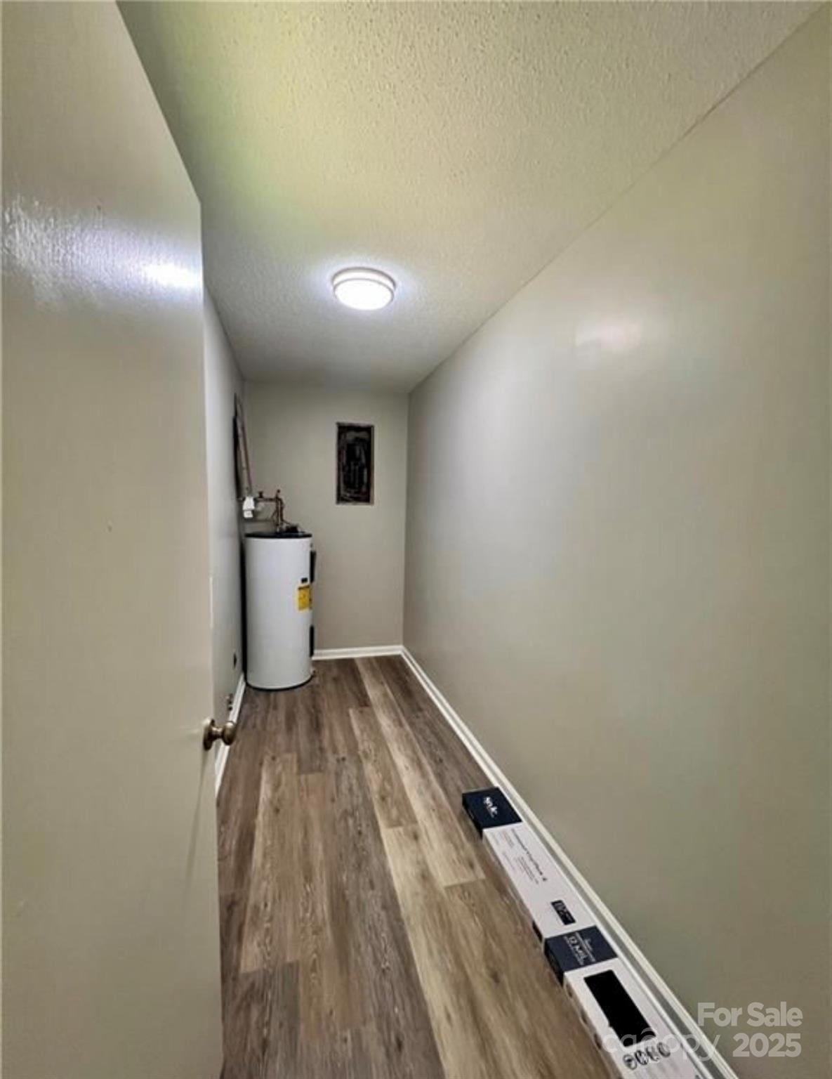 276 Country Club Road Wilkesboro, NC 28697 - Photo 15 of 16 a view of a room with wooden floor and white walls