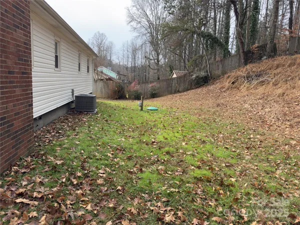 a view of a backyard of the house