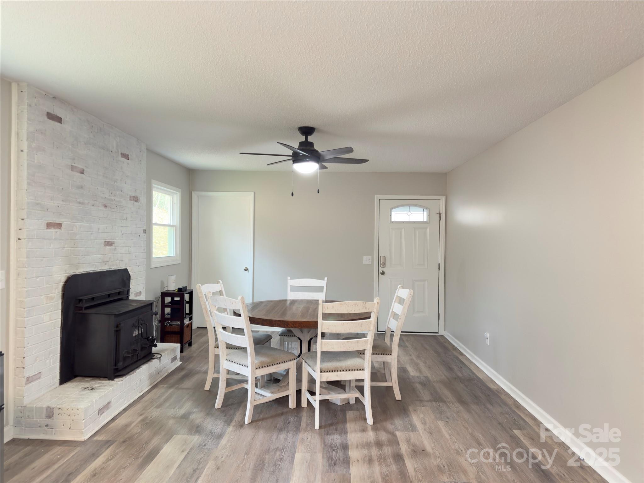 276 Country Club Road Wilkesboro, NC 28697 - Photo 4 of 16 a view of a dining room with furniture and wooden floor