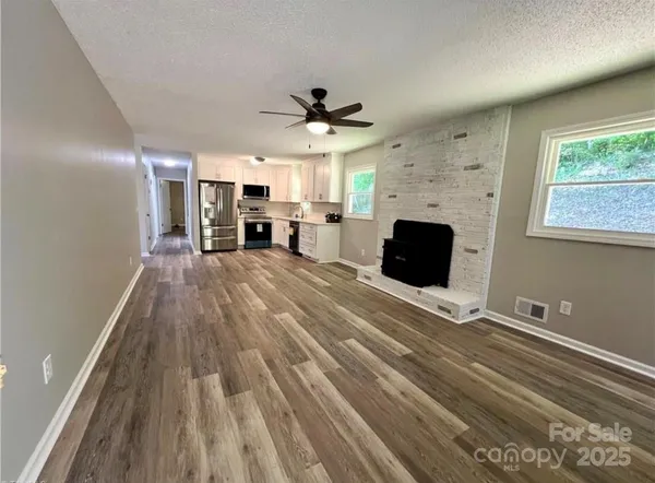 a living room with furniture and a fireplace