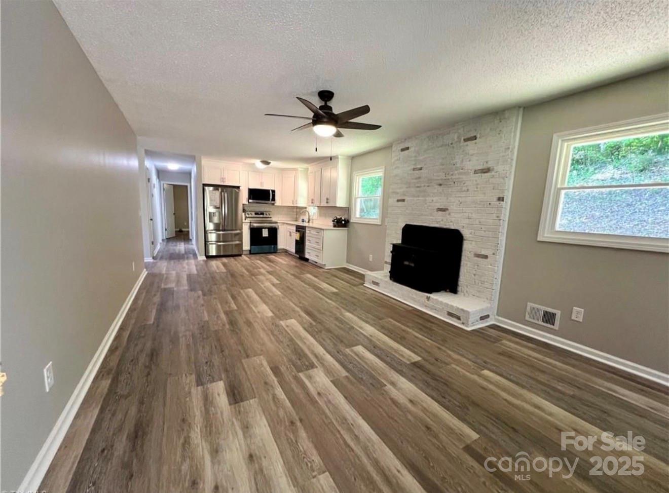 276 Country Club Road Wilkesboro, NC 28697 - Photo 6 of 16 a living room with furniture and a fireplace